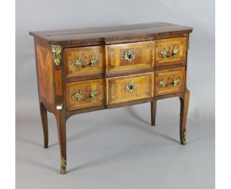 An 18th century Italian ormolu mounted walnut breakfront commode, cross-banded, line-inlaid and banded in harewood, fitted tw