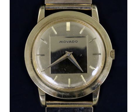 A gentleman's 18ct gold Movado manual wind wrist watch, on an associated 9ct gold brick link bracelet, with ridge and plain d