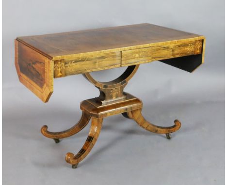 A Regency crossbanded and marquetry inlaid rosewood sofa table, with canted rectangular flaps and two frieze drawers, on U sh