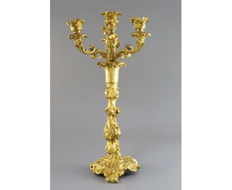 A Louis XVI ormolu four light candelabrum, decorated with foliate scroll motifs, height 17.25in.