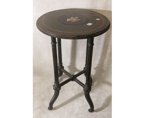 A 19th century occasional table having an inset micro mosaic plaque depicting birds over an ebonized base, 18 diameter