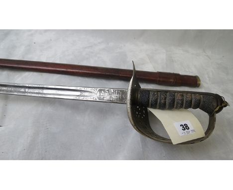 A George V dress sword having a pierced hand guard with leather scabbard and Wilkinson blade