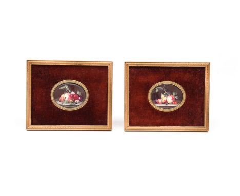 A pair of small oval English enamel plaques  c.1760, finely painted with arrangements of fruit and vegetables on a marble she