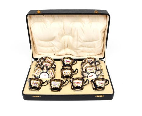A Royal Worcester cased coffee set date codes for 1928, of six coffee cups and saucers, painted in the 18th century manner wi