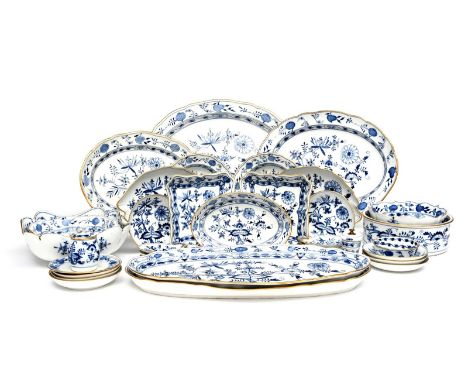 A Meissen part dinner service 19th century, paintred in underglaze blue in the Zwiebelmuster or Onion pattern, gilding to the