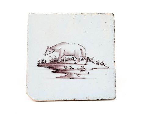 A rare Liverpool delftware tile  c.1760, painted in manganese with a bear standing with head slightly turned, a chip to one c