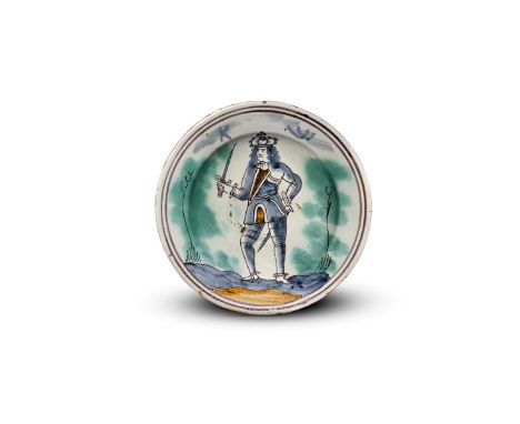 A delftware Royal charger  c.1690-1700, probably London, painted with a full length standing portrait of King William III in 