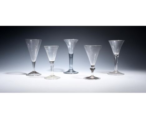 Five soda wine glasses  c.1750-60, four with drawn trumpet bowls over plain stems, two enclosing long tears, the last with a 