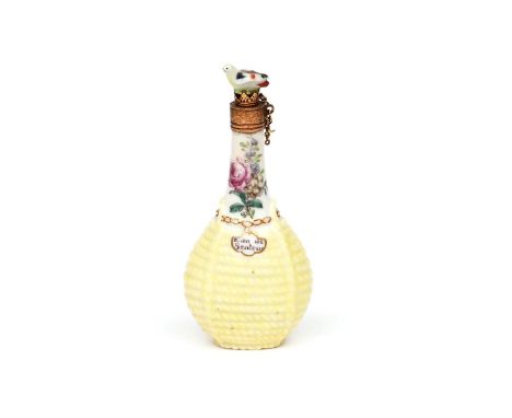 A Chelsea scent bottle  c.1755, modelled as a bottle contained in a yellow wicker basket, the neck painted with sprays of flo