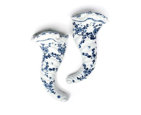 A pair of Worcester blue and white wall pockets c.1755-60, the cornucopia forms painted in the Cornucopia Prunus pattern with