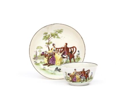 A London-decorated Chinese porcelain teabowl and saucer c.1757, printed and coloured with the Tea Party pattern of a couple s