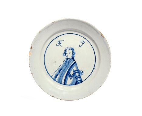 A rare English delftware King of Prussia plate  c.1757-60, painted in blue with a head and shoulders portrait of Frederick II