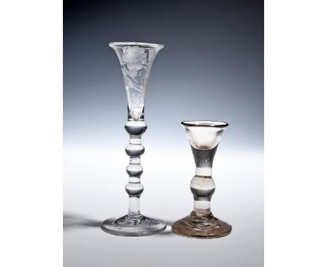 A Dutch gin glass of Jacobite interest c.1750, the slender bowl engraved with a rose and bud spray, raised on a multi-knopped