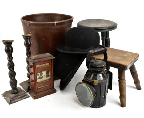 A late 19th century beech milking stool with rectangular top on turned legs, height 21.5cm, with an ebonised circular top sto