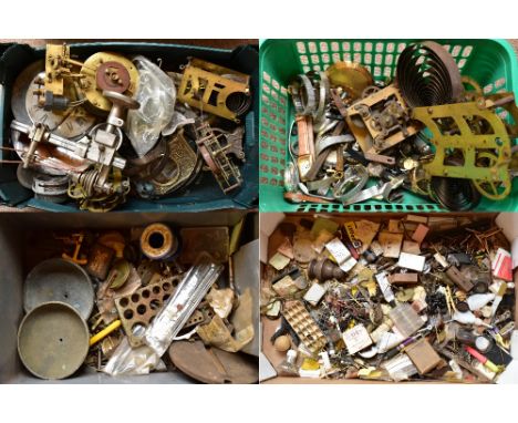 A quantity of assorted watchmaker's parts and equipment to include a lathe, clock faces, wristwatch parts, a cased set of too