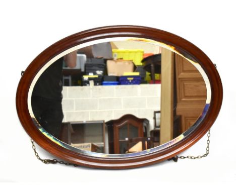 An Edwardian mahogany oval wall mirror with bevelled plate, width 84cm, height 59cm.Additional InformationLight scuffs and ma