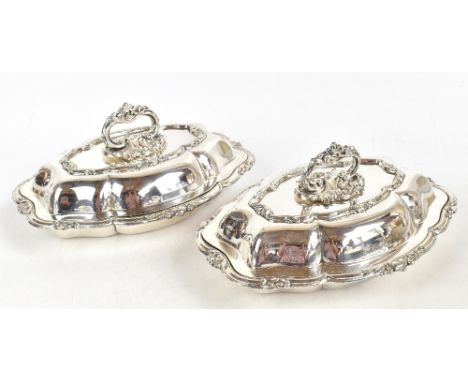A pair of 19th&nbsp;century silver plated entrée dishes and covers, of shaped oval form, with foliate rims and detachable scr