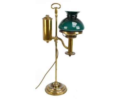 A brass reading lamp with green glass shade, height 58cm.