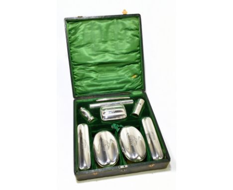 ROBERT CHANDLER; a cased George V hallmarked silver nine piece gentleman's vanity set, comprising a comb, a toothbrush holder