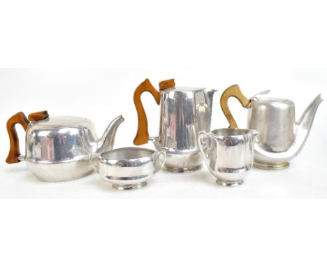 PICQUOT WARE; a five-piece tea set.Additional InformationOne of the wooden handles is quite stained, as you can see. Otherwis