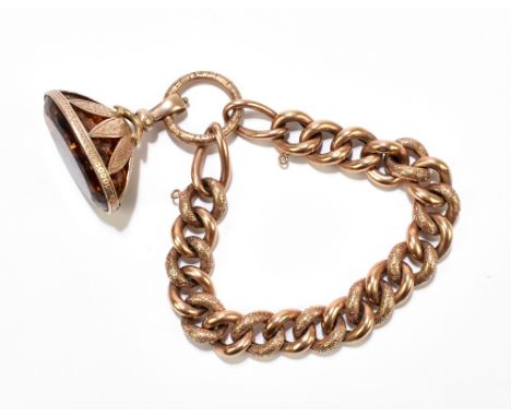 A substantial 9ct rose gold bracelet supporting a large yellow metal mounted amber fob, the bracelet and ring loop approx 30g