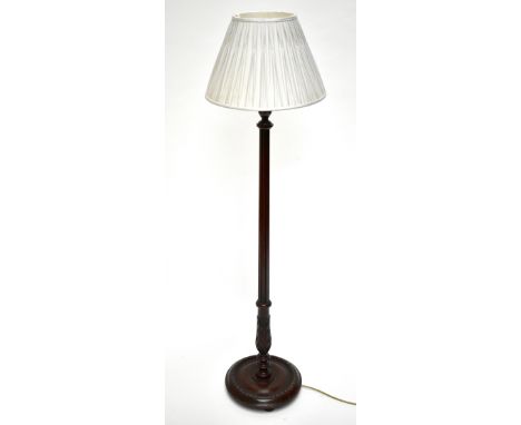 A stained beech standard lamp of small proportions, with fluted and carved column on circular base, height 126cm.Additional I