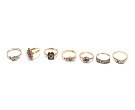 Seven rings, comprising unmarked example set with white and red coloured stones (one of the latter missing), size N, an unmar