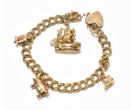 A 9ct yellow gold curb linked bracket with padlock clasp, with four 9ct gold charms, approx 23.6g.Additional InformationGener