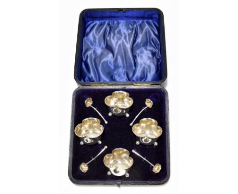 HENRY AITKIN; a cased Edwardian hallmarked silver set of four trefoil shaped open salts with matching spoons, Sheffield 1902,