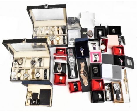 A large quantity of lady's and gentleman's fashion wristwatches by assorted makers, mostly boxed, with 24 in watch boxes, inc