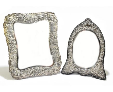 KEYFOLD FRAMES LTD; an Elizabeth II hallmarked silver easel back silver mounted dressing table mirror of shaped circular form