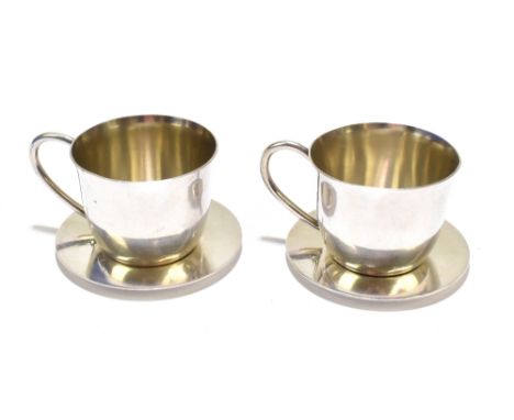 A pair of US sterling silver miniature teacups and saucers, all components stamped 'Sterling' to base, approx 1.7ozt/55g.Addi
