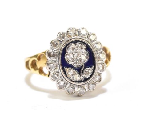 A Victorian style yellow gold ring set with diamonds with central blue enamel panel and floral decoration, carved shoulders, 