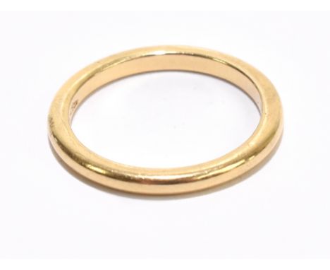 A yellow metal wedding band stamped 750, size L, approx 3.1g.Additional InformationMinimal wear, light scratches and wear, ni