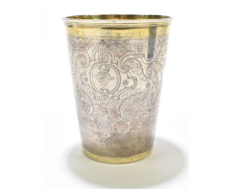 An early 18th&nbsp;century Russian parcel-gilt silver beaker of large size, the exterior with a repeating design of two elabo