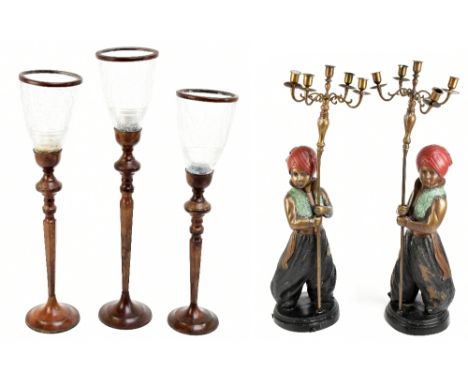 A pair of contemporary metal five light figural candelabra modelled as young Eastern boys holding the sconces aloft, height 7