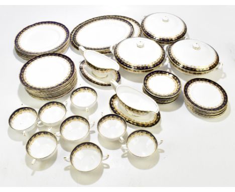 ROYAL WORCESTER; an 'Arundel' fifty-two piece part dinner service, with gilt floral detail on a cobalt and white glazed body.