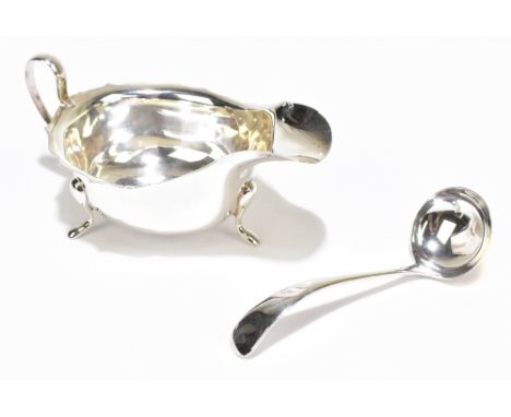 THOMAS TURNER &amp; CO; a George V hallmarked silver cased sauce boat and sauce ladle, Sheffield 1933, the sauce boat length 