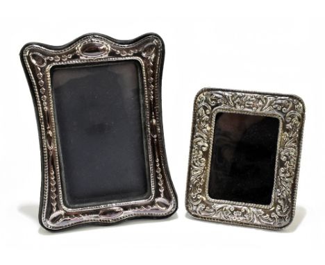 WHITEHILL SILVER &amp; PLATE CO; an Elizabeth II hallmarked silver mounted easel back photograph frame with cast floral detai