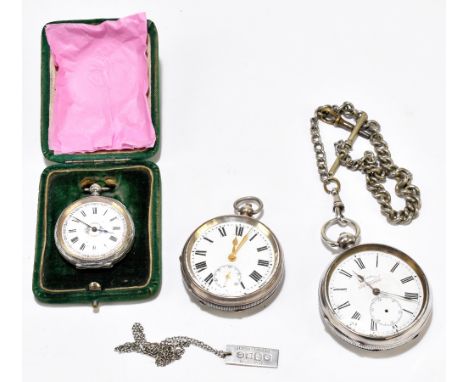 Two silver key wind open face pocket watches, both with Roman numerals set to the white enamel dials and a cased silver fob w