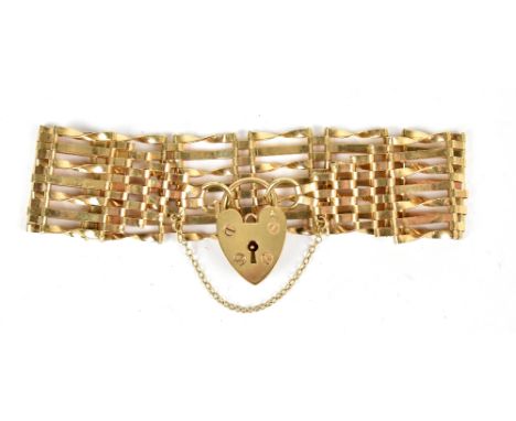 A 9ct yellow gold gate link bracelet with padlock clasp, weight&nbsp;approx. 15.8g.Additional InformationLight surface wear a