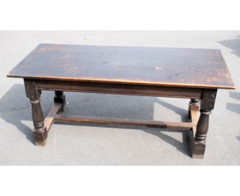 An 18th century style stained oak refectory table, with rectangular top on turned and block legs with H-shaped stretcher, hei