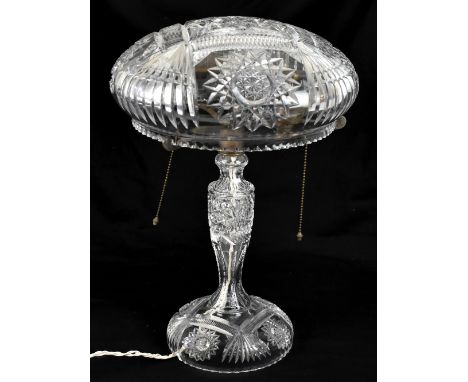 A clear cut glass three bulb mushroom lamp on tapered column to circular base, height 47cm.Additional InformationOverall appe