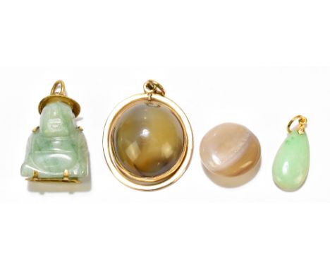 A Chinese carved jade and yellow metal mounted pendant, a small yellow metal mounted jade tear shaped pendants, a brown yello