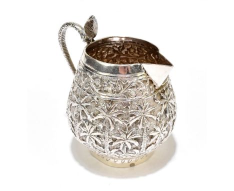 An Indian white metal jug with snake head handle and palm tree decoration to the body, unmarked, height 9.5cm, approx. 3.7ozt
