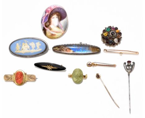 A group of brooches&nbsp;including a&nbsp;Victorian yellow metal example set with carved coral medallion of a classical femal