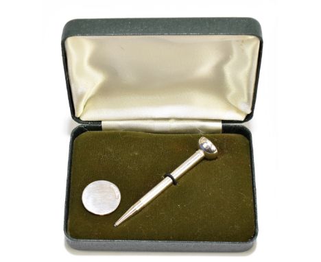 A boxed silver novelty pencil modelled as a golf tee stamped 'Sterling Silver', length 6.2cm, and a place marker, William H M