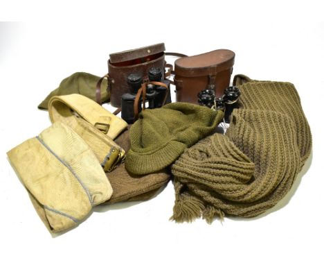 A WWI military full length wool coat, size 5, with a military cap, two knitted green wool hats and two knitted green wool sca