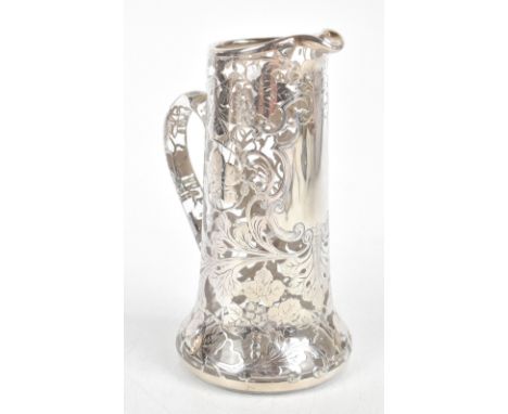 A good clear glass and floral motif silver overlaid lemonade jug with vacant cartouche and star cut base, height 22cm.Additio