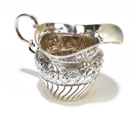 GEORGE NATHAN &amp; RIDLEY HAYES; a late Victorian hallmarked silver cream jug with part gadrooned body and embossed foliate 
